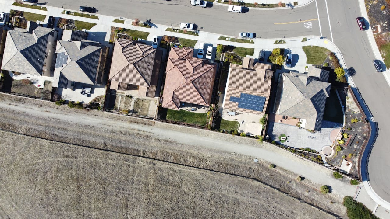 Overhead view of suburban houses with solar panels in Dublin, CA neighborhood.
